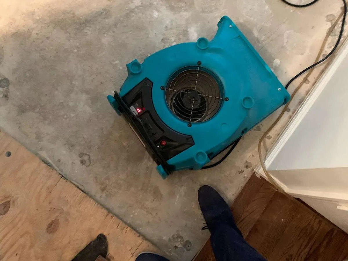 Air mover drying subfloor during Leak Detection & Repair in Desert Hot Springs